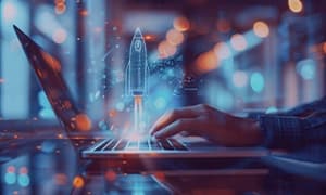 Person working on laptop with digital rocket launch symbol, representing software development services for startups.