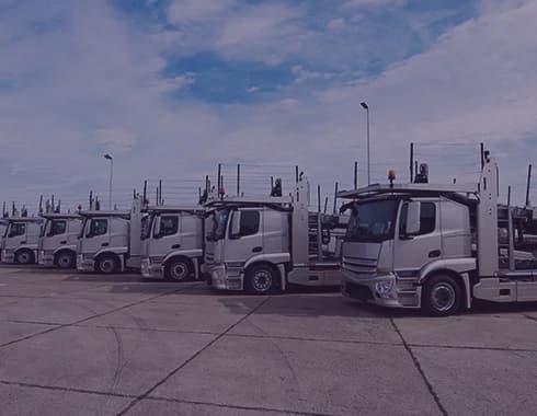 Fleet of automobiles representing a case study on custom CRM built with product development services for the automobile industry.