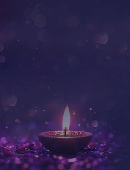 Lit diyas glowing in the dark, symbolizing hope, positivity, and innovations for social cause.