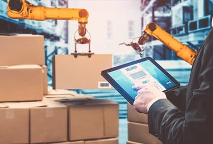 Person using tablet to manage warehouse automation and deliveries, representing iLogistech 3PL logistics software for efficient supply chain management.