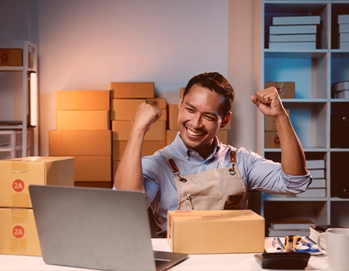 American logistics company manager celebrating successful operations using iLogistech 3PL logistics software solutions.