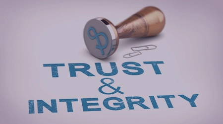 Business professionals shaking hands in a meeting room, symbolizing teamwork and building culture in the organization.